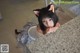 A woman in a cat costume leaning on a counter.