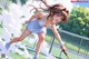 A woman in a white dress playing tennis on a court.