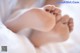 A close up of a baby's feet on a bed.