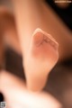 A close up of a woman's feet with a pair of socks on.